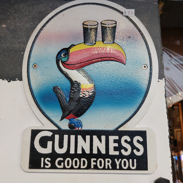 Cast iron guinness sign