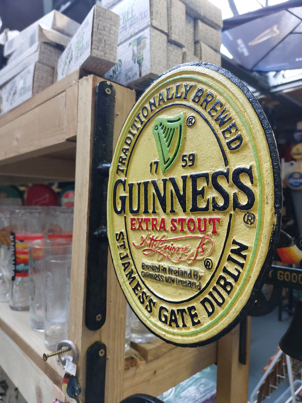 Cast iron guinness sign