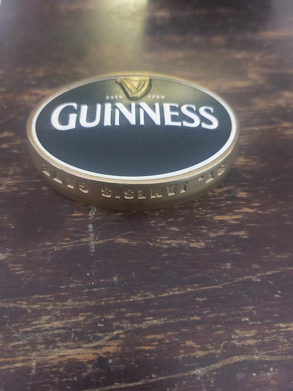 Guinness fish eye badge