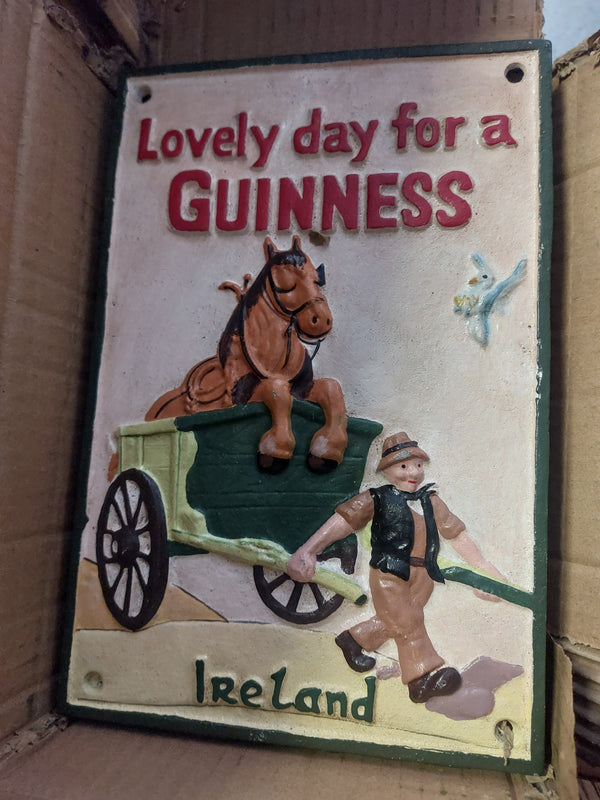 Cast iron guinness sign